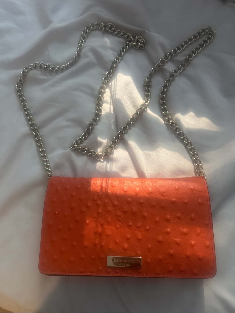 kate spade orange textured crossbody with silver chain